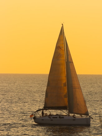 a sailboat in the middle of a body of water