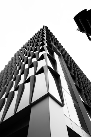 a black and white photo of a tall building