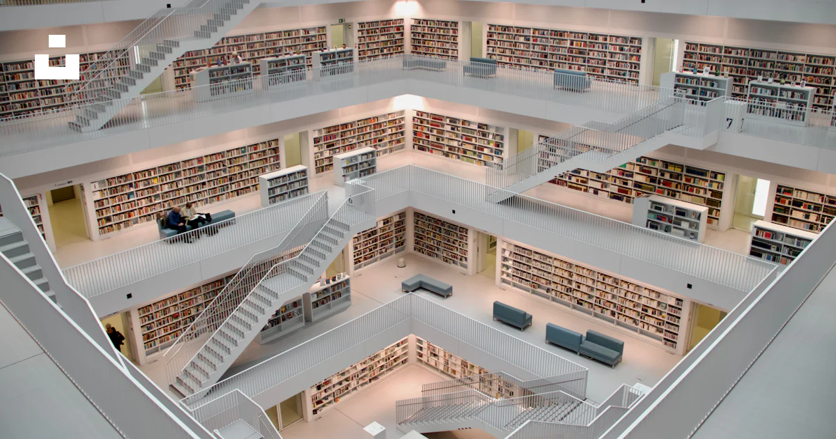 A large library filled with lots of books photo – Free Architecture ...