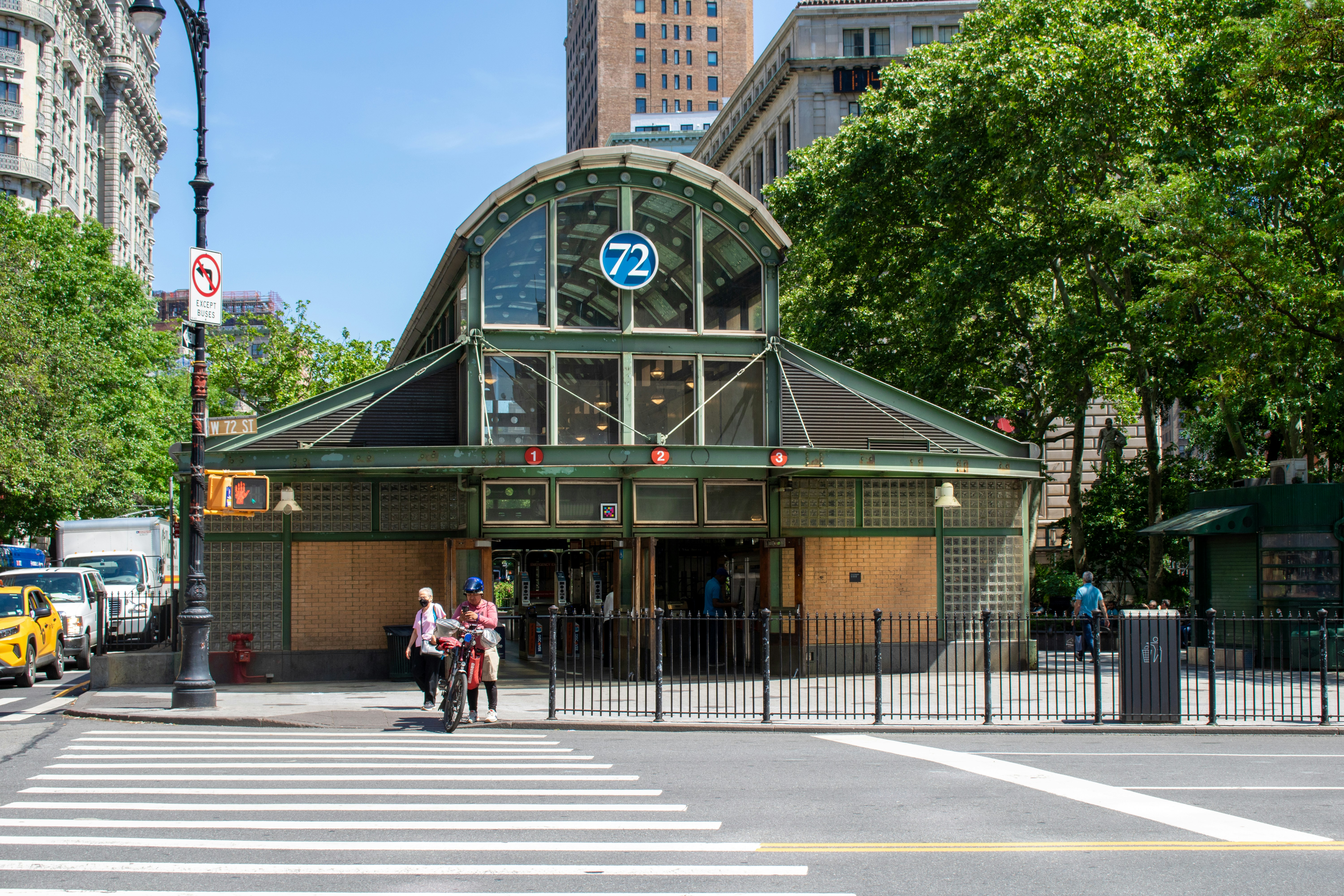a couple of people that are standing in front of a building