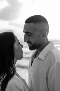 a black and white photo of a man and a woman