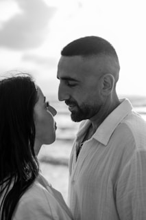 a black and white photo of a man and a woman