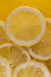 a bunch of lemons that are in a bowl
