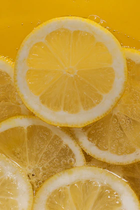 a bunch of lemons that are in a bowl