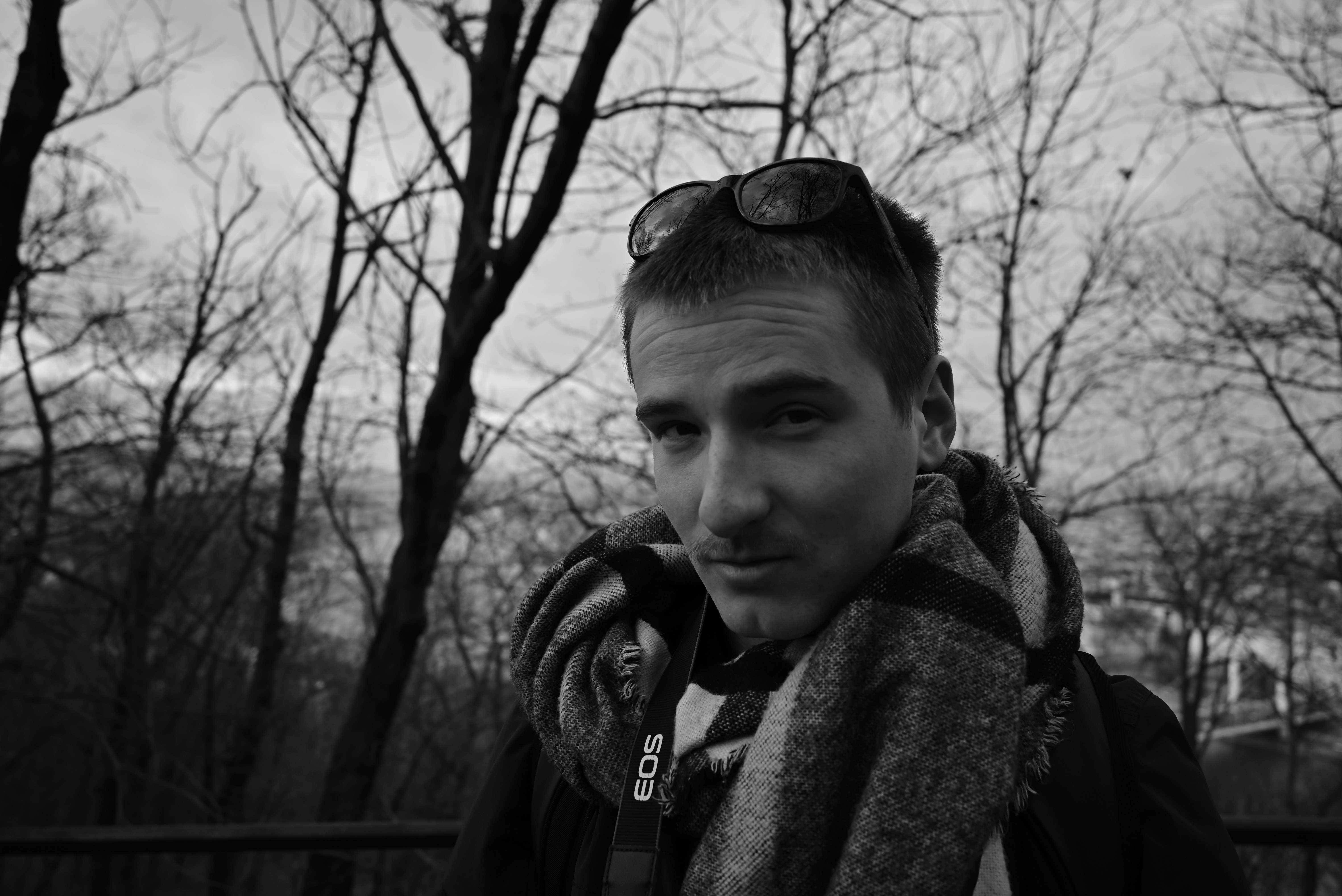 a man with a scarf around his neck