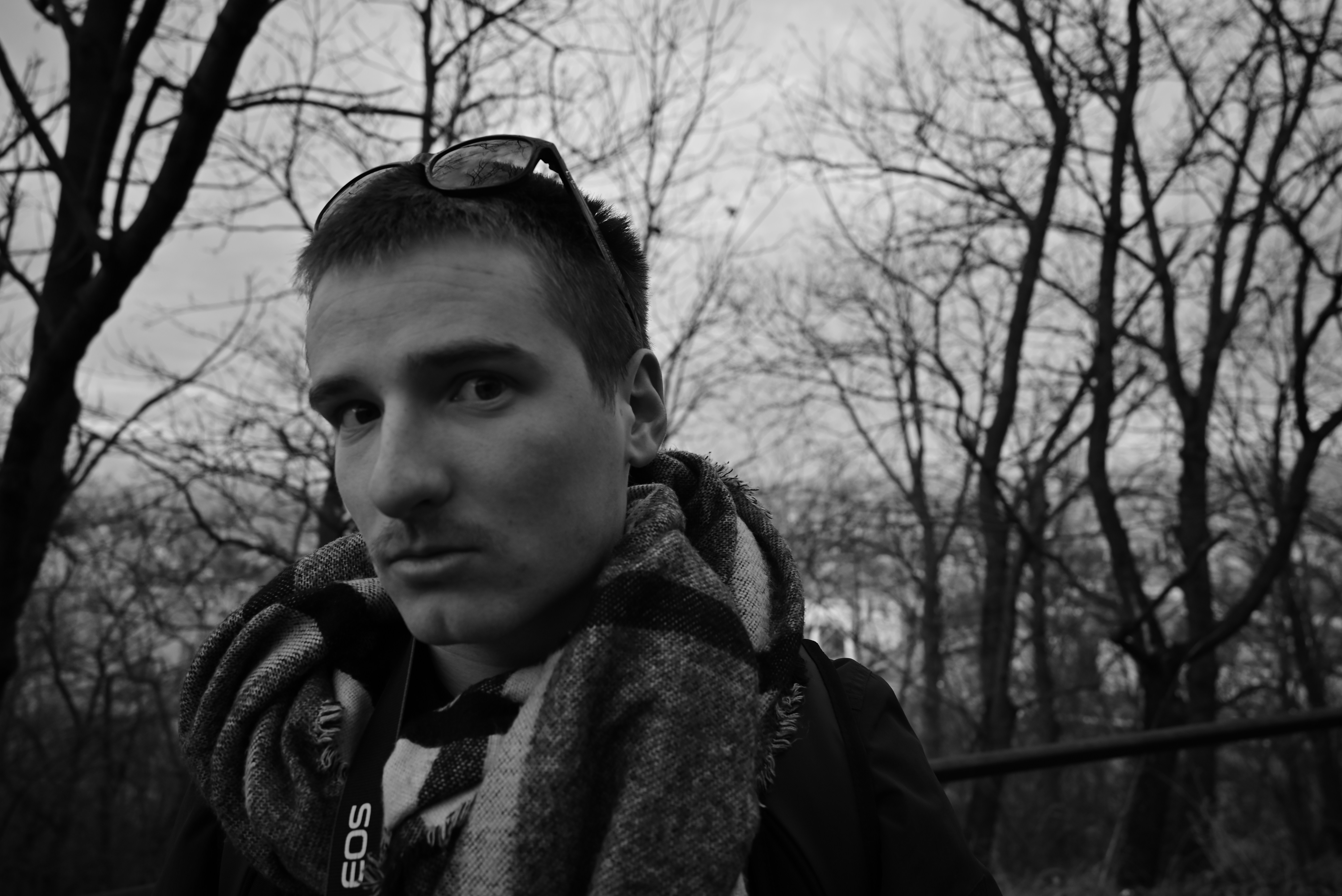 a man with a scarf around his neck