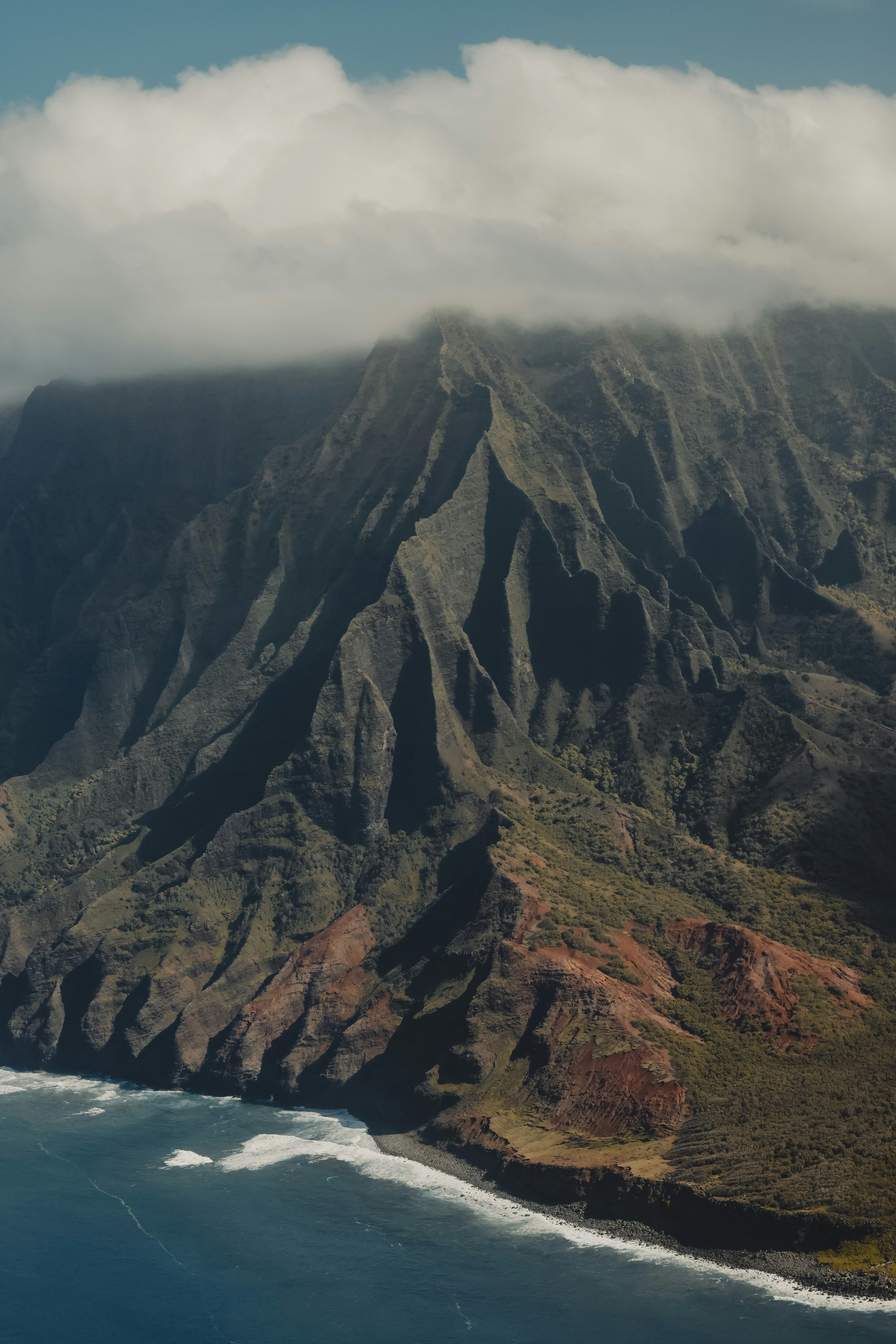 a view of a mountain with a body of water below it