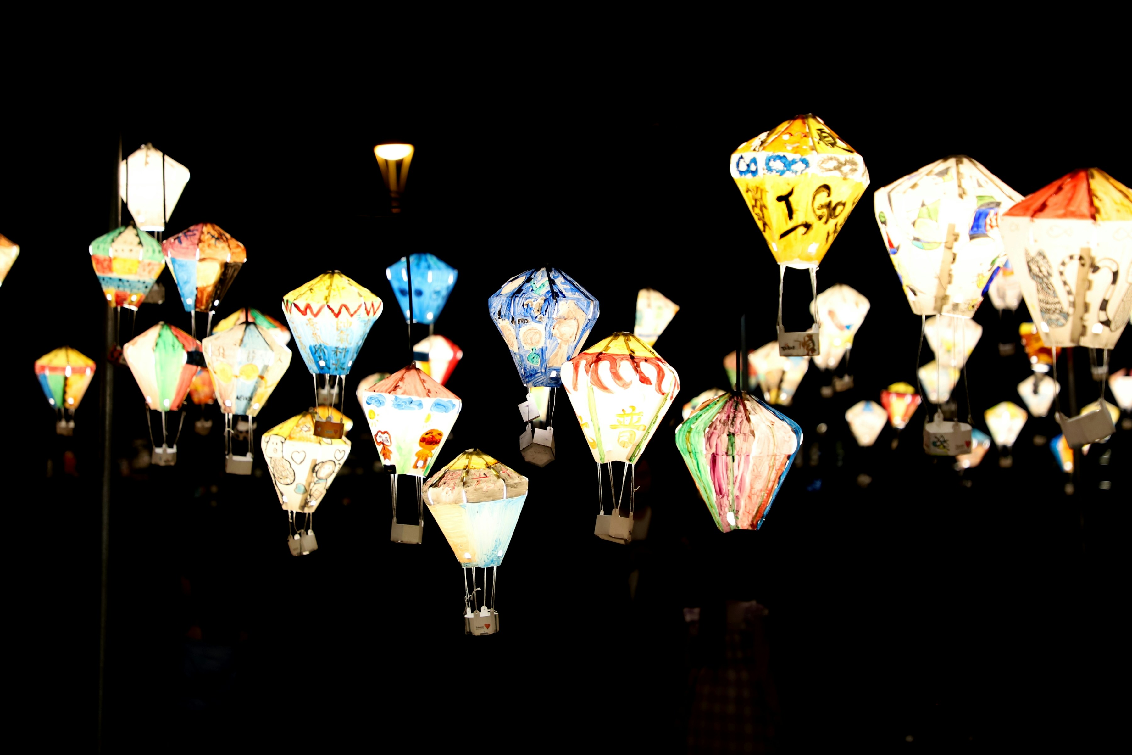 a group of colorful hot air balloons floating in the air