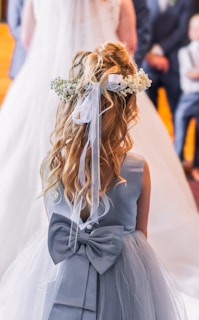 A little girl walking down the aisle at a wedding