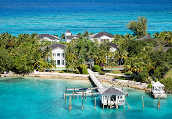 an aerial view of a tropical island with a dock