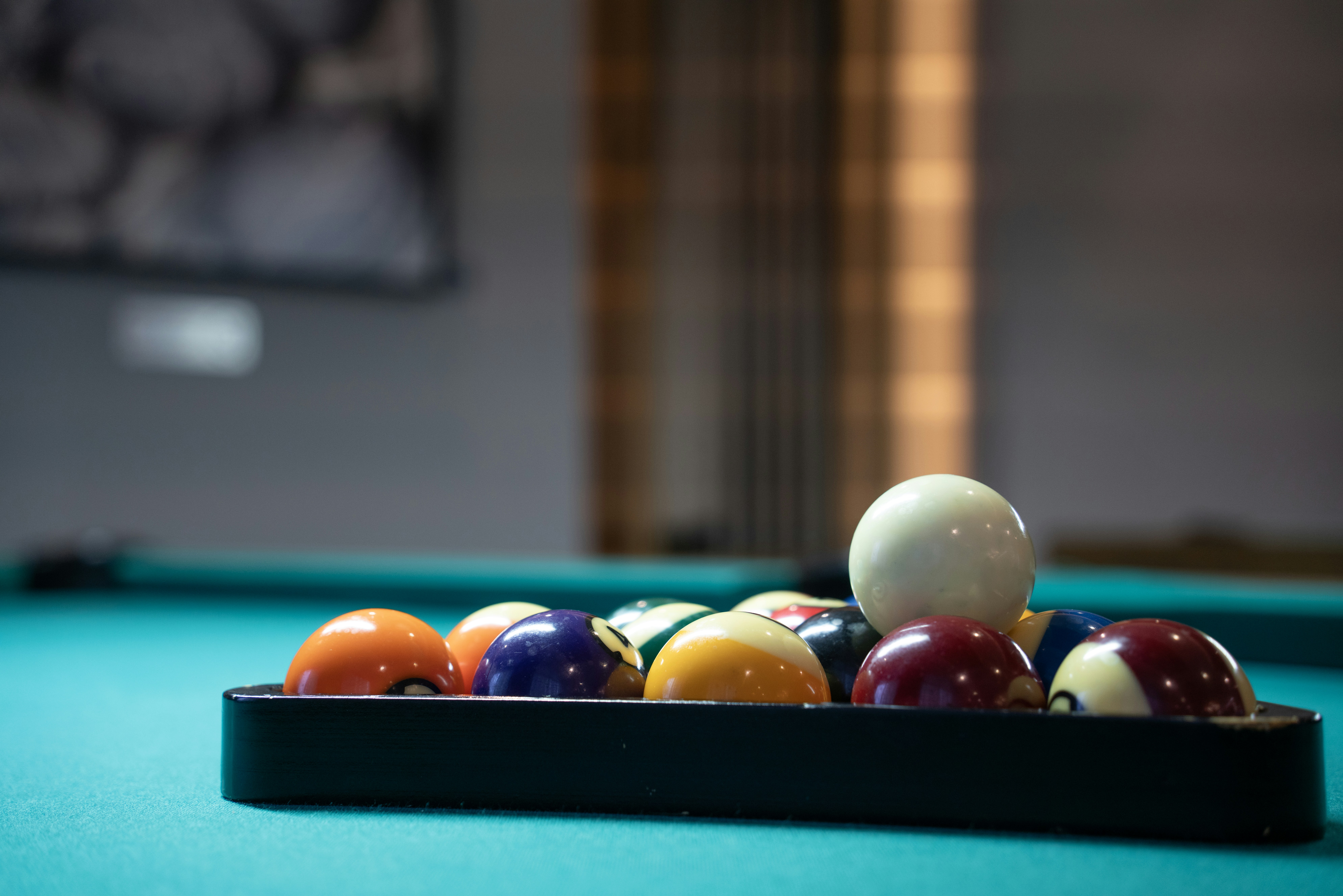 A pool table with a rack of pool balls photo Free Miami Image on Unsplash