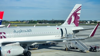 a large jetliner sitting on top of an airport tarmac