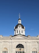 a tall building with a cross on top of it