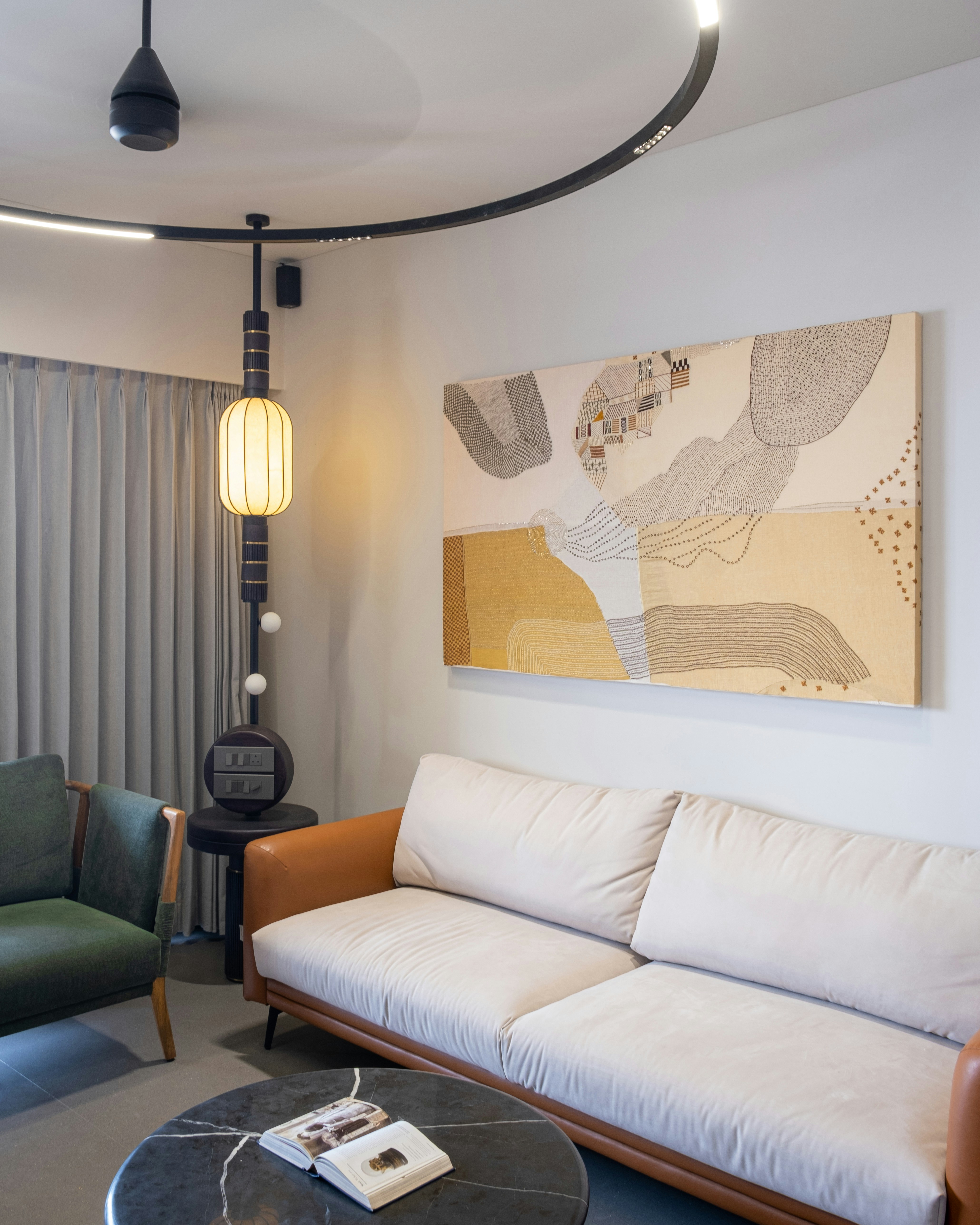 Modern living room with large abstract painting above sofa
