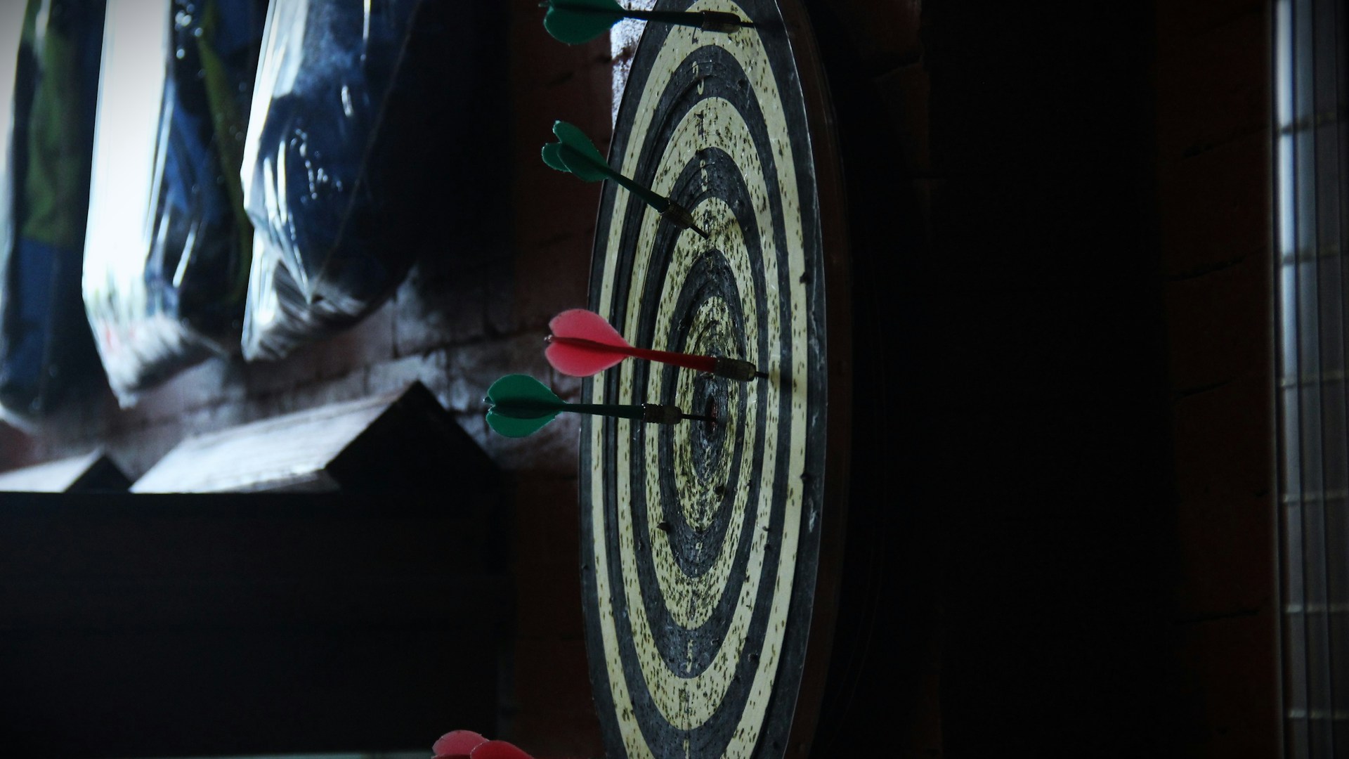 a close up of a clock with arrows on it