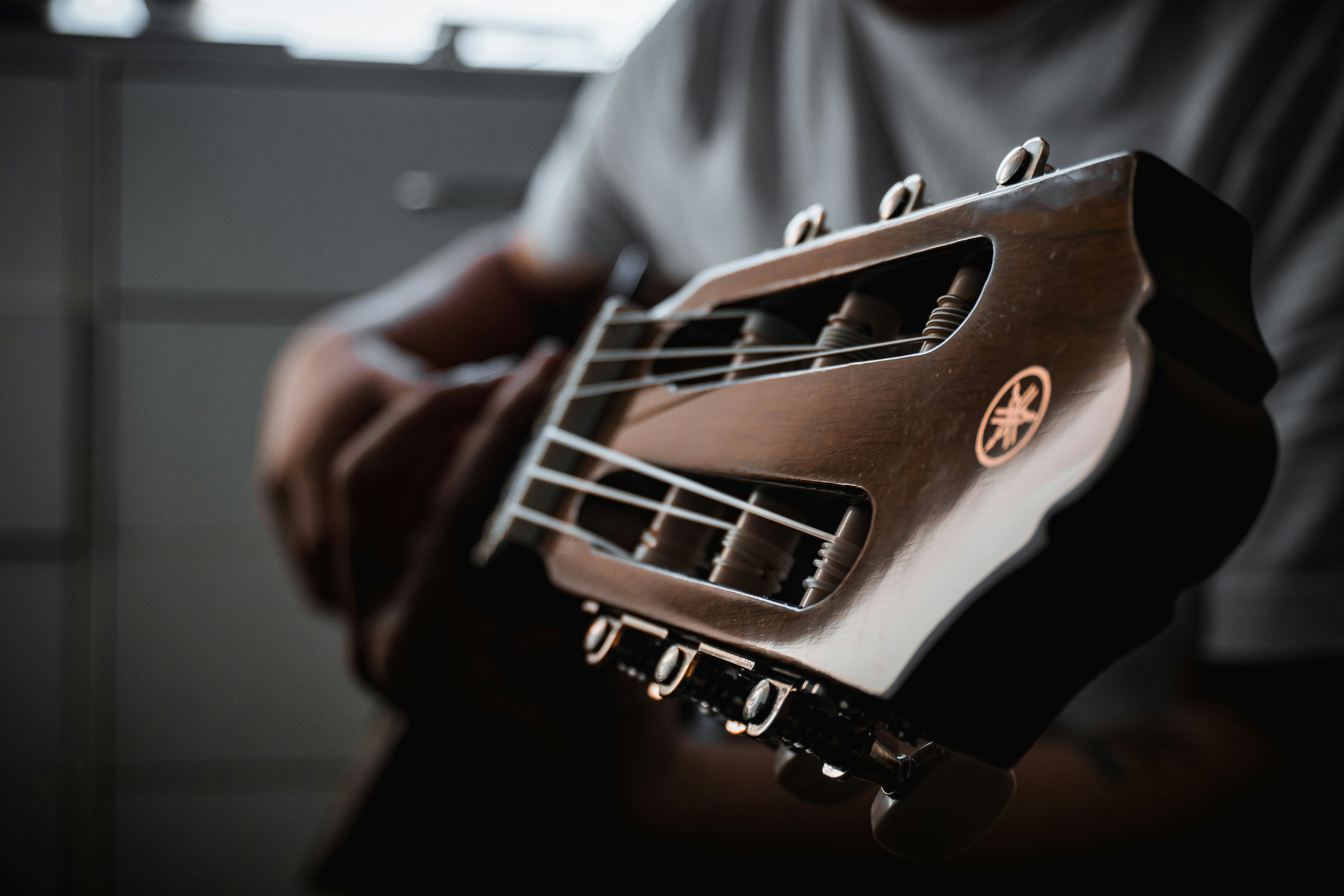 a close up of a person holding a guitar