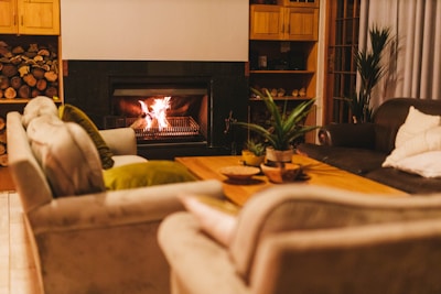 a living room filled with furniture and a fire place