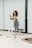 a woman is running on a treadmill
