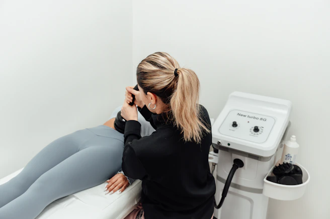 a woman getting her leg examined by a doctor