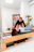 a couple of women are doing exercises in a gym