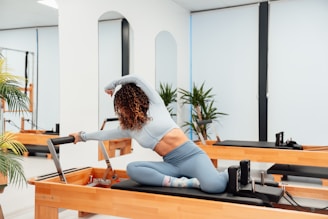 a woman is doing exercises on a pilates