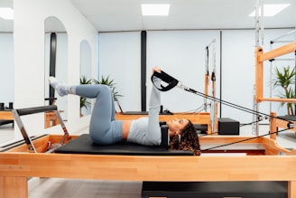 a woman is doing a plank exercise in a gym