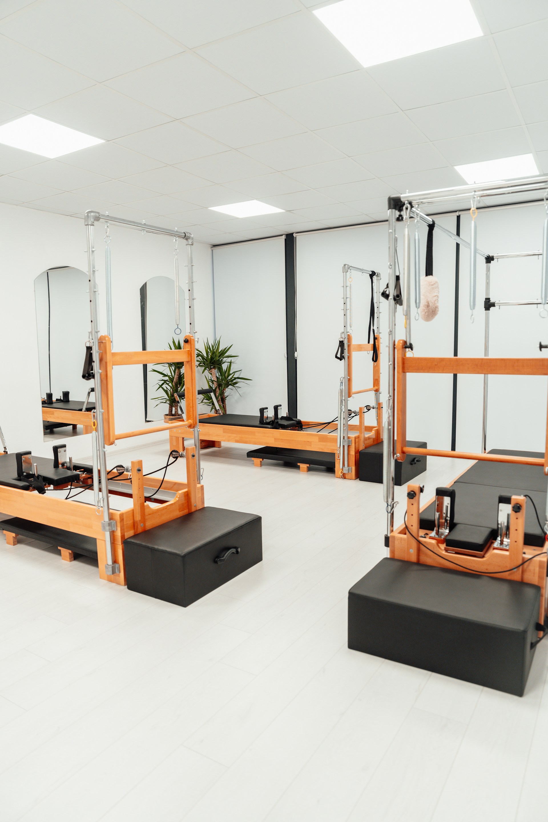 a white room with mirrors and equipment in it