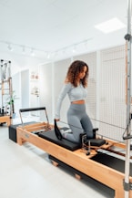 a woman on a treadmill in a gym
