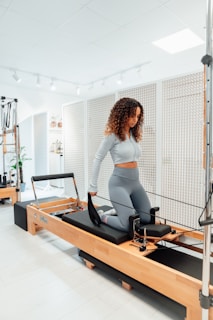 a woman on a treadmill in a gym