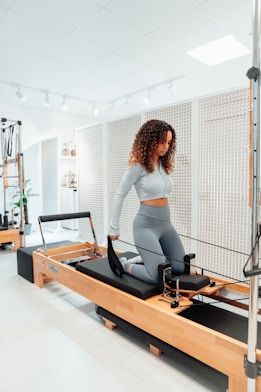a woman on a treadmill in a gym