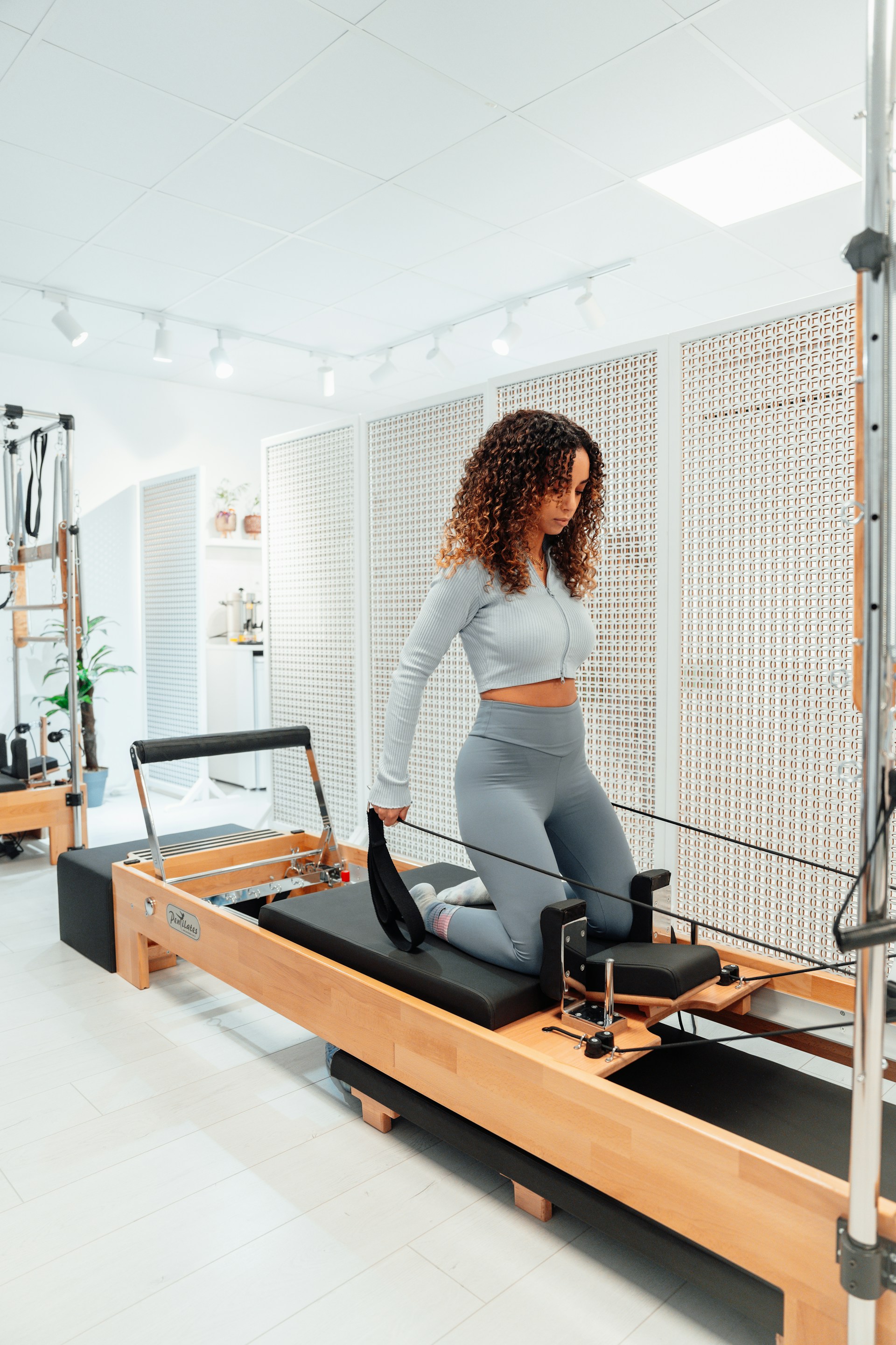 a woman on a treadmill in a gym