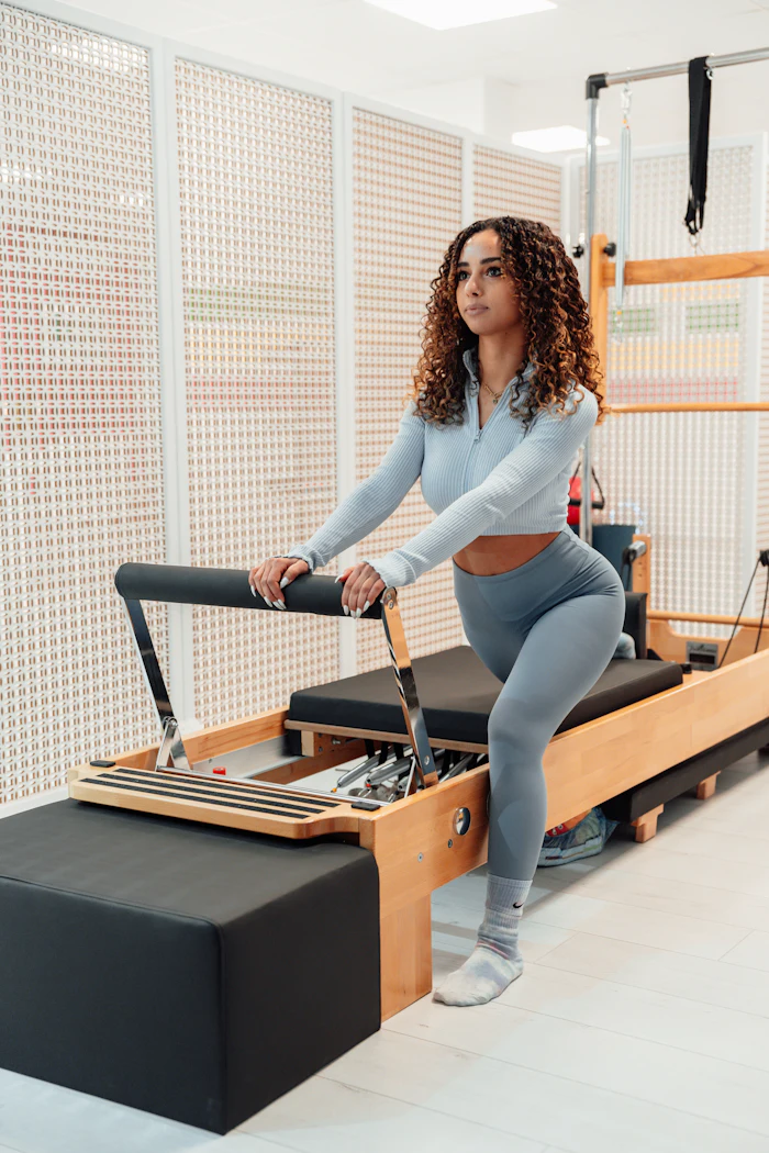 Instructor Tess on the reformer