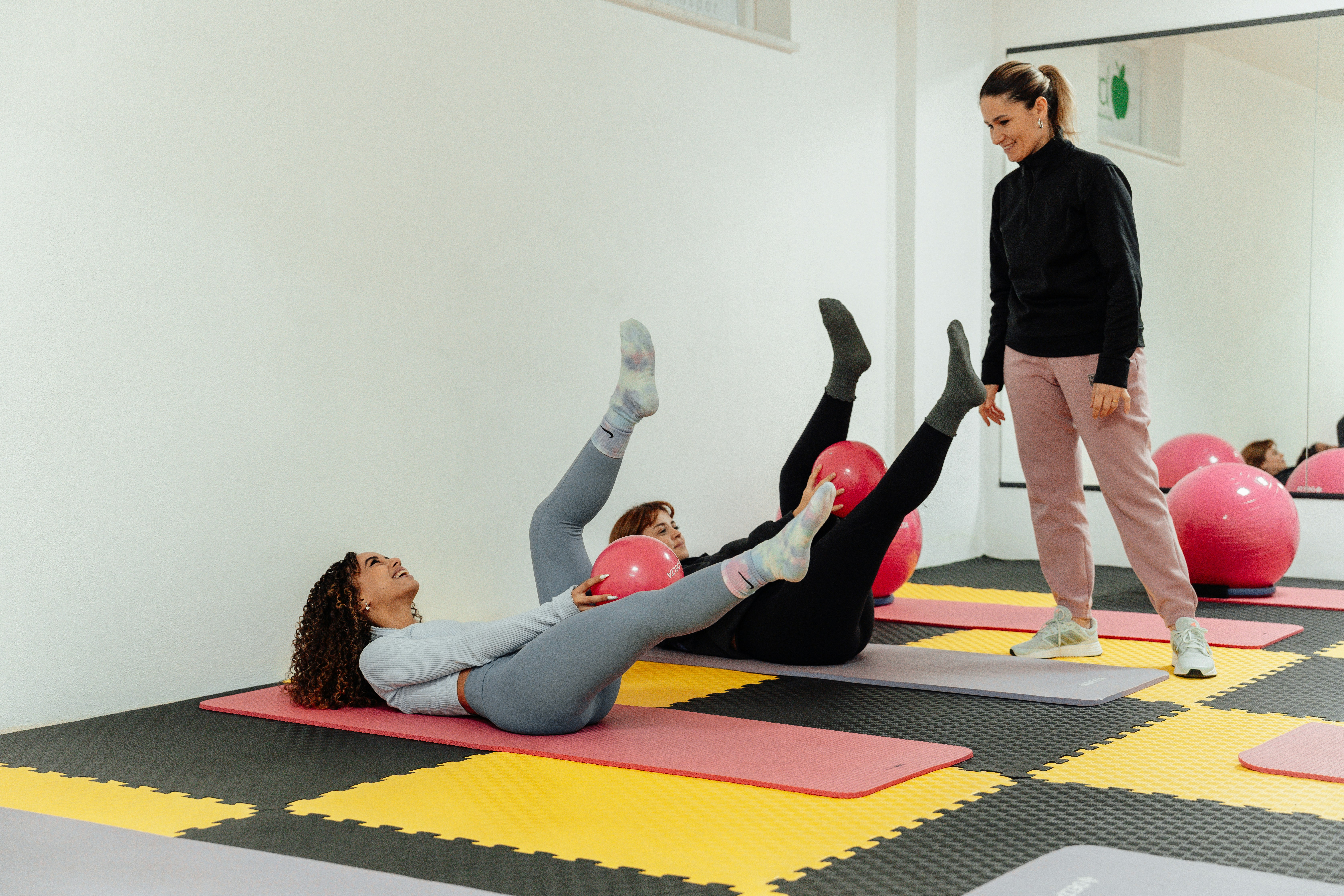 a group of people doing exercises in a gym