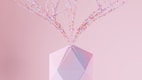 a crystal vase with pink flowers in it