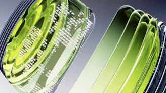 a close up of a green object on a white surface