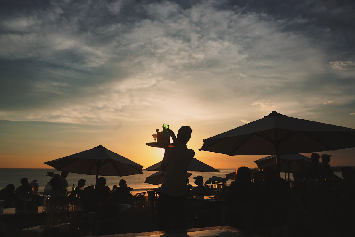 Sunset cocktail lounges and refined coastal dining along Seminyak Beach