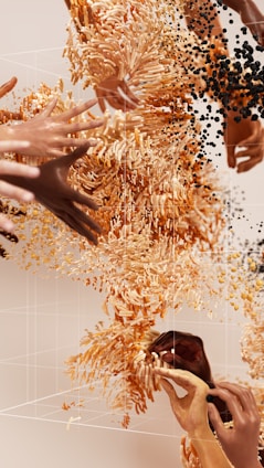 a group of hands reaching for a cell phone