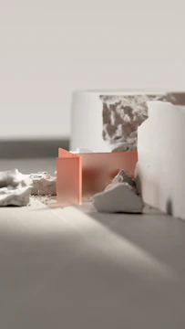 a close up of a white vase on a table