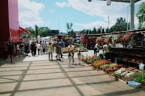 a group of people walking around a market