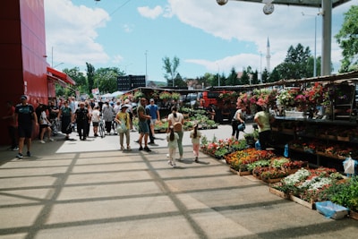 a group of people walking around a market