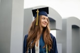 a woman in a graduation cap and gown