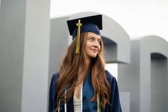 a woman in a graduation cap and gown