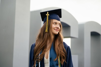a woman in a graduation cap and gown