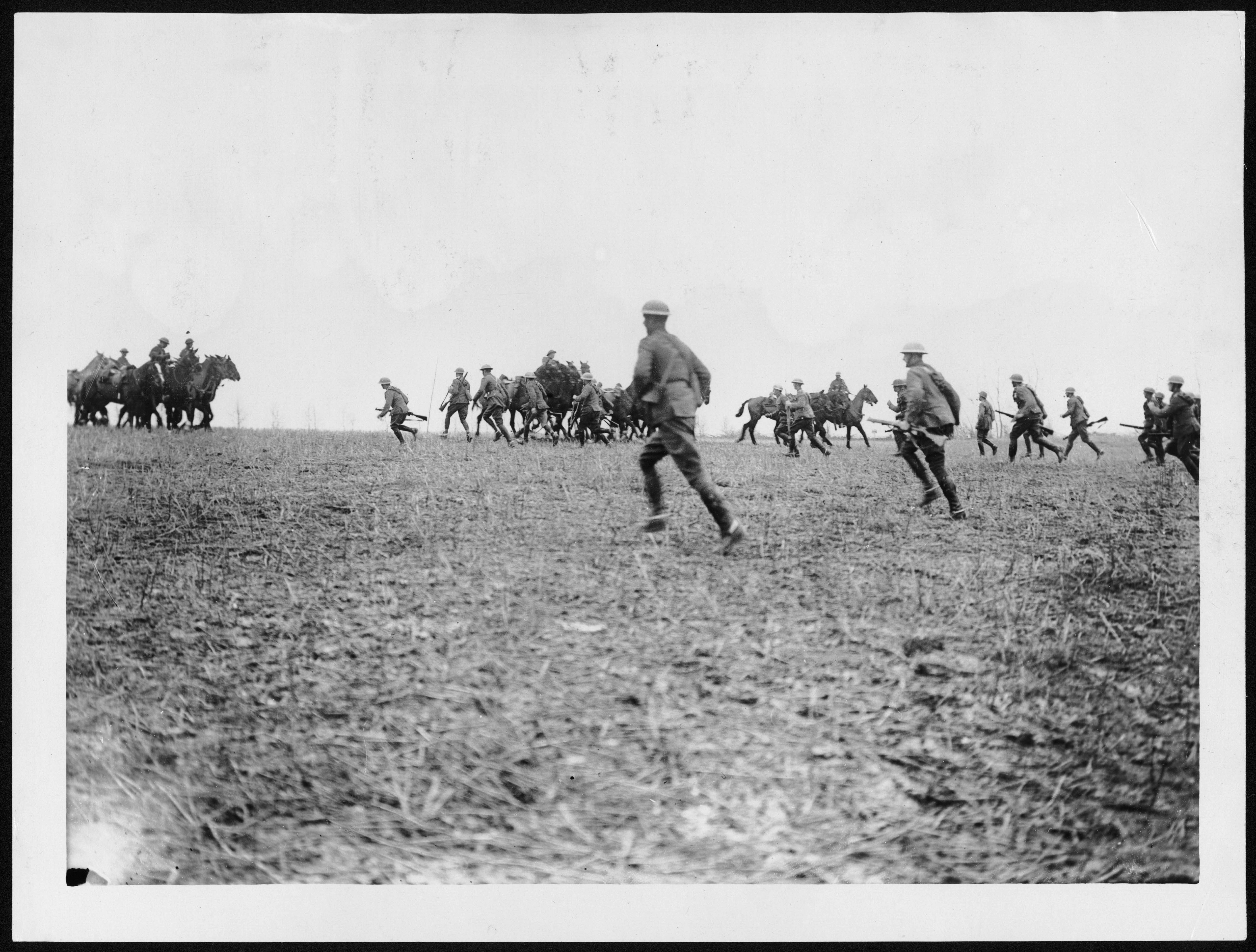 a group of men playing a game of frisbee