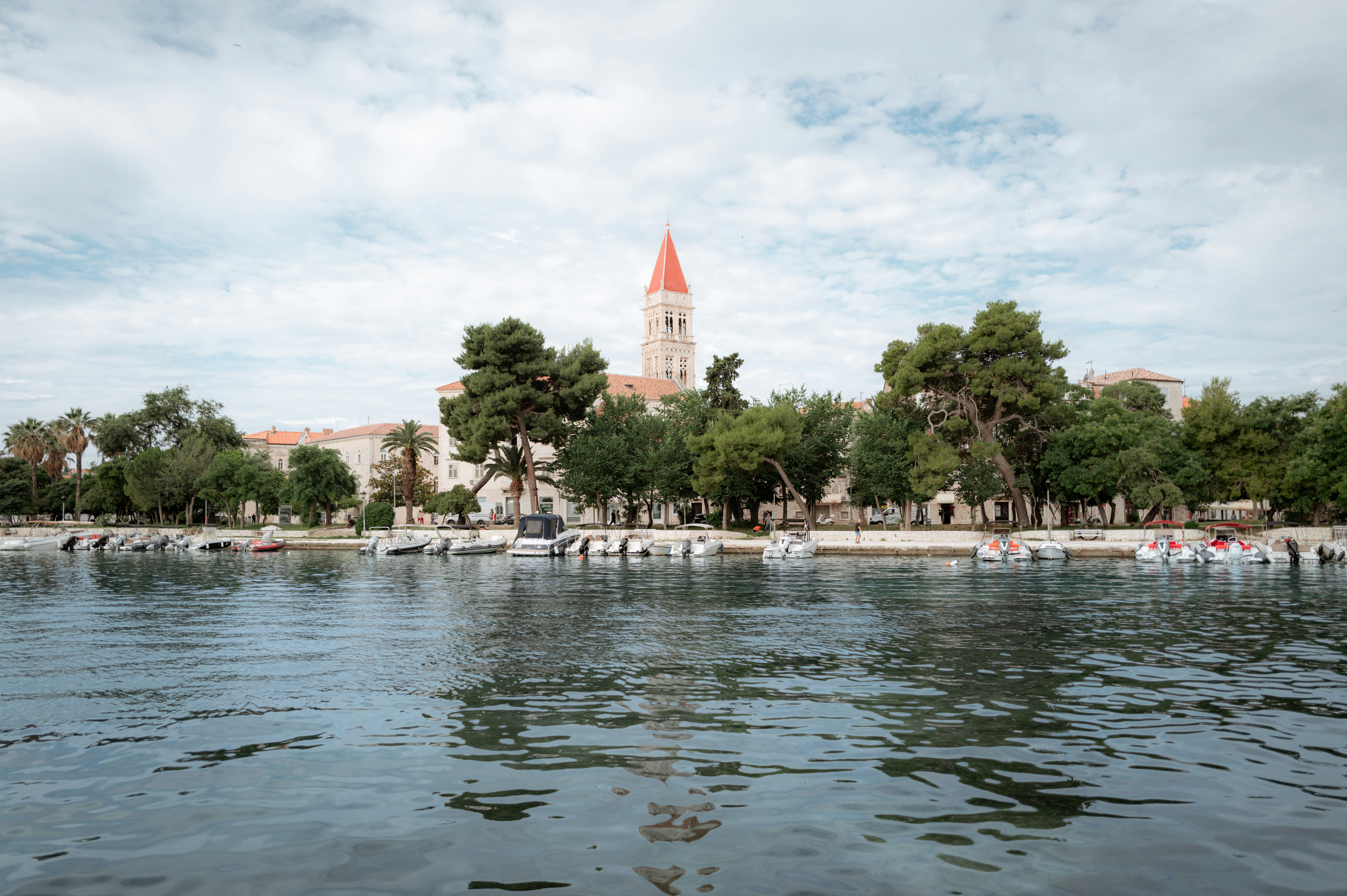 a large body of water with a church in the background