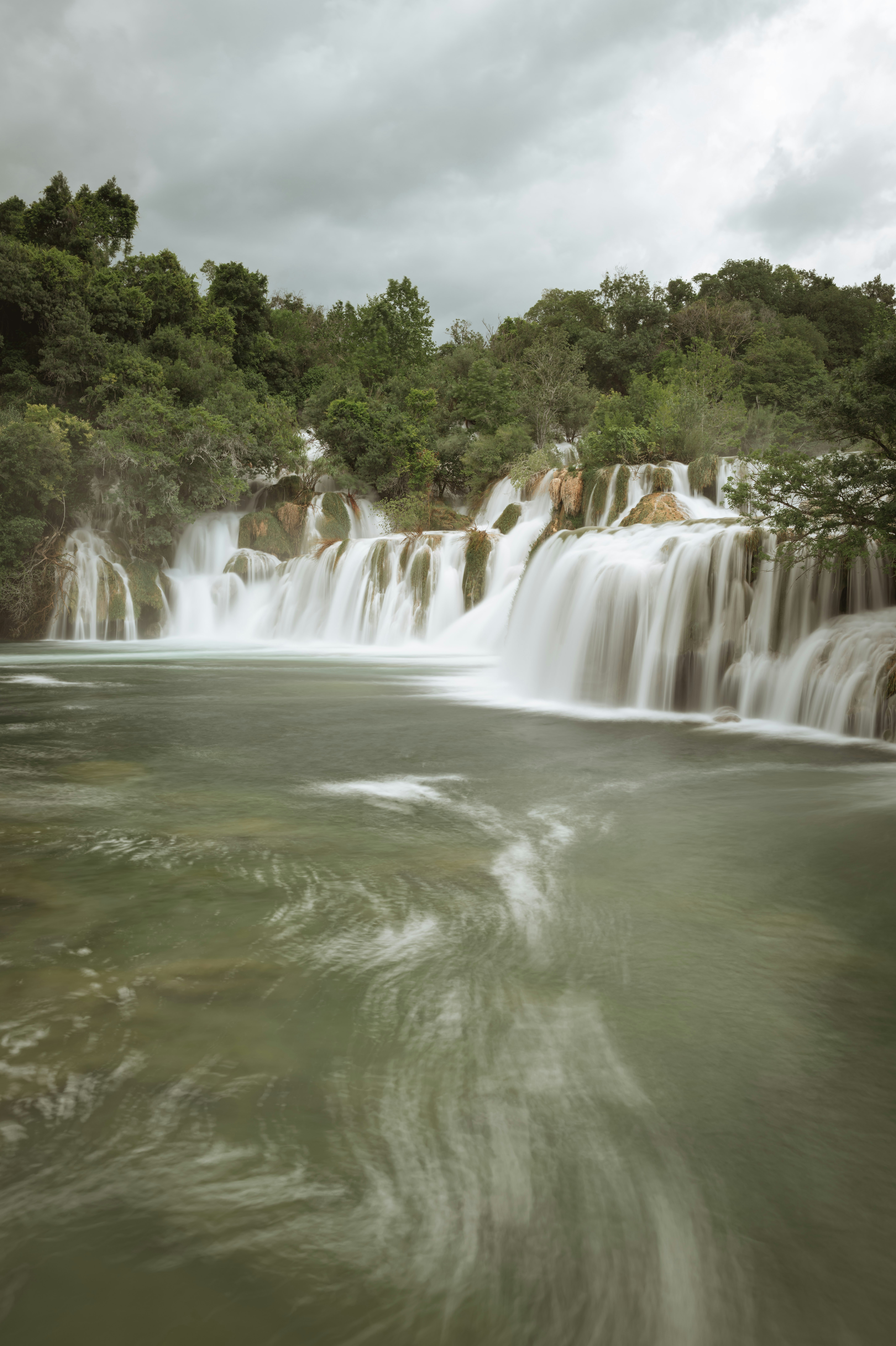 a large waterfall with lots of water coming out of it