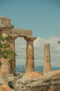 a man riding a horse in front of some ancient ruins
