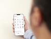 a person holding a cell phone in their hand