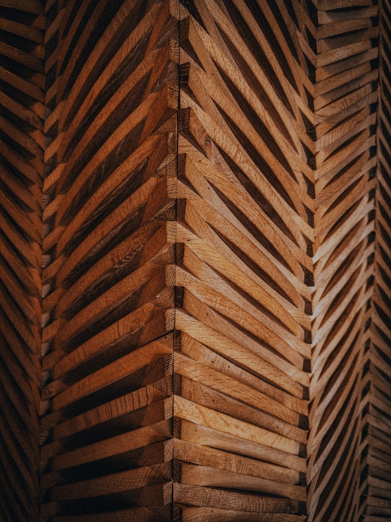 a close up of a wall made of wooden planks