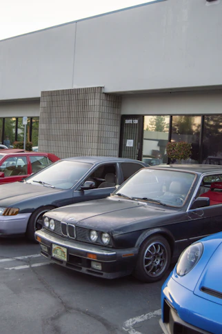 a group of cars parked in a parking lot